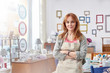 © Rafal Rodzoch/Caia Image - Portrait confident mature female artist painting in art studio