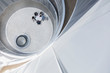 © Caiaimage/Martin Barraud/Caia Image - View from above business people meeting at table in round office atrium courtyard