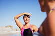 © Caiaimage/Sam Edwards/Caia Image - Smiling female open water swimmers on sunny beach