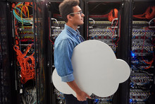Male IT Technician Carrying Cloud In Server Room, Cloud Computing