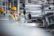 © Martin Barraud/Caia Image - Portrait confident female worker with digital tablet in steel factory