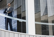 © Caiaimage/Martin Barraud/Caia Image - Portrait confident CEO businessman standing in office window