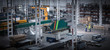 © Martin Barraud/Caia Image - Workers talking in the distance in factory