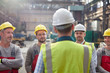 © Lukasz Olek/Caia Image - Male foreman talking, meeting with workers in factory