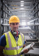 © Martin Barraud/Caia Image - Portrait serious, confident male supervisor with clipboard in steel factory