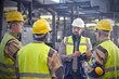 © Caiaimage/Agnieszka Olek/Caia Image - Supervisor talking with steelworkers in steel mill