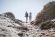 © Sam Edwards/Caia Image - Couple walking on sunny summer beach path