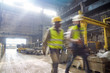 © Caiaimage/Agnieszka Olek/Caia Image - Steelworkers walking in steel mill