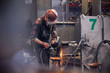 © Caiaimage/Agnieszka Olek/Caia Image - Steelworker using lathe in steel mill