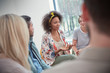© Caiaimage/Agnieszka Olek/Caia Image - Woman talking in group therapy session