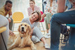 © Caiaimage/Agnieszka Olek/Caia Image - Woman petting dog in group therapy session