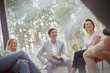 © Caiaimage/Rafal Rodzoch/Caia Image - Smiling people talking in group therapy session