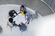 © Caiaimage/Martin Barraud/Caia Image - Architects reviewing blueprints, planning at table