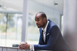 © Caiaimage/Martin Barraud/Caia Image - Serious businessman drinking coffee in office