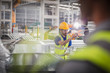 © Martin Barraud/Caia Image - Male worker pointing, working in steel factory
