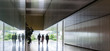 © Caiaimage/Martin Barraud/Caia Image - Silhouette business people walking in modern corridor