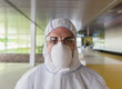 © Caiaimage/Martin Barraud/Caia Image - Portrait serious scientist in clean suit