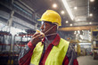 © Caiaimage/Agnieszka Olek/Caia Image - Steelworker removing protective mask in steel mill