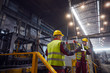 © Caiaimage/Agnieszka Olek/Caia Image - Steelworkers moving steel part in steel mill