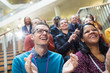 © Sam Edwards/Caia Image - Laughing, happy conference audience clapping