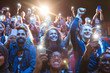 © Sam Edwards/Caia Image - Excited audience with smart phone flashlights cheering