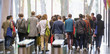 © TomMerton/Caia Image - Business people leaving office lobby