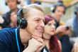 © Martin Barraud/Caia Image - Smiling businessman with headphones listening in conference audience