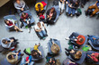© TomMerton/Caia Image - Overhead view conference audience listening to speaker in wheelchair