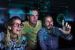 © Robert Daly/Caia Image - Designers viewing data on futuristic hologram screen