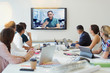 © Robert Daly/Caia Image - Designers video conferencing with colleague in conference room meeting