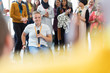 © Martin Barraud/Caia Image - Audience clapping for female speaker in wheelchair