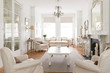 © Charlie Dean/Caia Image - White luxury home showcase interior living room fireplace chandelier