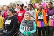 © Chris Ryan/Caia Image - Crowd cheering at charity run