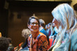 © Sam Edwards/Caia Image - Laughing businesswomen in conference audience