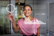 © Robert Daly/Caia Image - Smiling, enthusiastic businesswoman using futuristic hologram computer