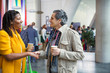 © Sam Edwards/Caia Image - Businessman and businesswoman networking, handshaking at conference