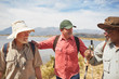 © Trevor Adeline/Caia Image - Active senior men friends hiking at sunny lakeside