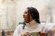 © Sam Edwards/Caia Image - Laughing, happy woman drinking coffee