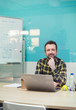 © Robert Daly/Caia Image - Portrait confident businessman working at laptop in conference room