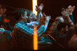 © Tom Merton/Caia Image - Audience clapping in dark room