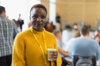 © Martin Barraud/Caia Image - Portrait confident businesswoman drinking coffee at conference