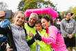© Chris Ryan/Caia Image - Enthusiastic family runners taking selfie at charity race