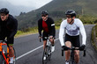 © Richard Johnson/Caia Image - Male cyclists cycling on road
