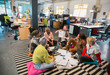 © Chris Ryan/Caia Image - Creative business people meeting, brainstorming in circle on floor in office