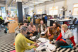 © Chris Ryan/Caia Image - Creative business team meeting, brainstorming on floor in office
