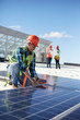 © Trevor Adeline/Caia Image - Engineer testing solar panel at power plant