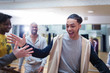 © Sam Edwards/Caia Image - Enthusiastic teenage boy high-fiving classmate in dance class studio