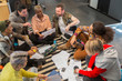 © Chris Ryan/Caia Image - Creative business people meeting, brainstorming in circle on floor