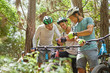 © Trevor Adeline/Caia Image - Friends mountain biking, using wearable camera in woods