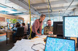 © Chris Ryan/Caia Image - Creative business people working in open plan office
